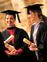 Image of students with graduation hats and robes